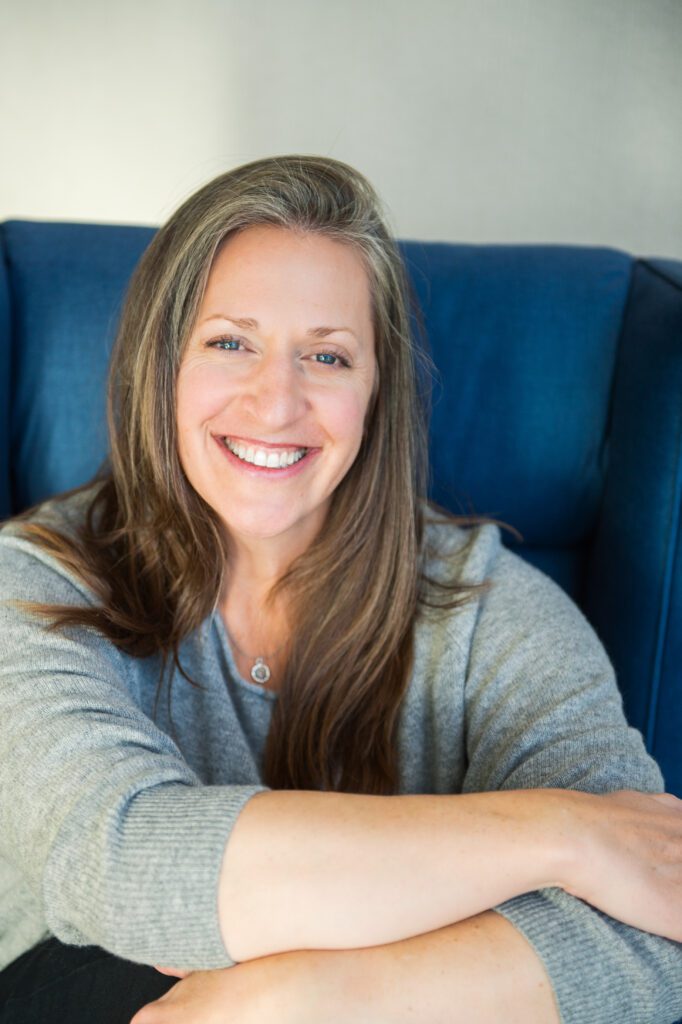 Caryn smiling at camera